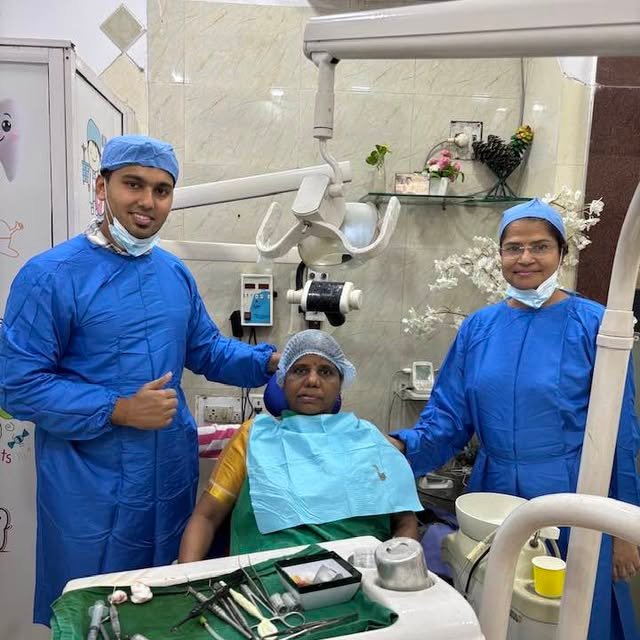 Dr. Alka and her dental team with a smiling patient after treatment